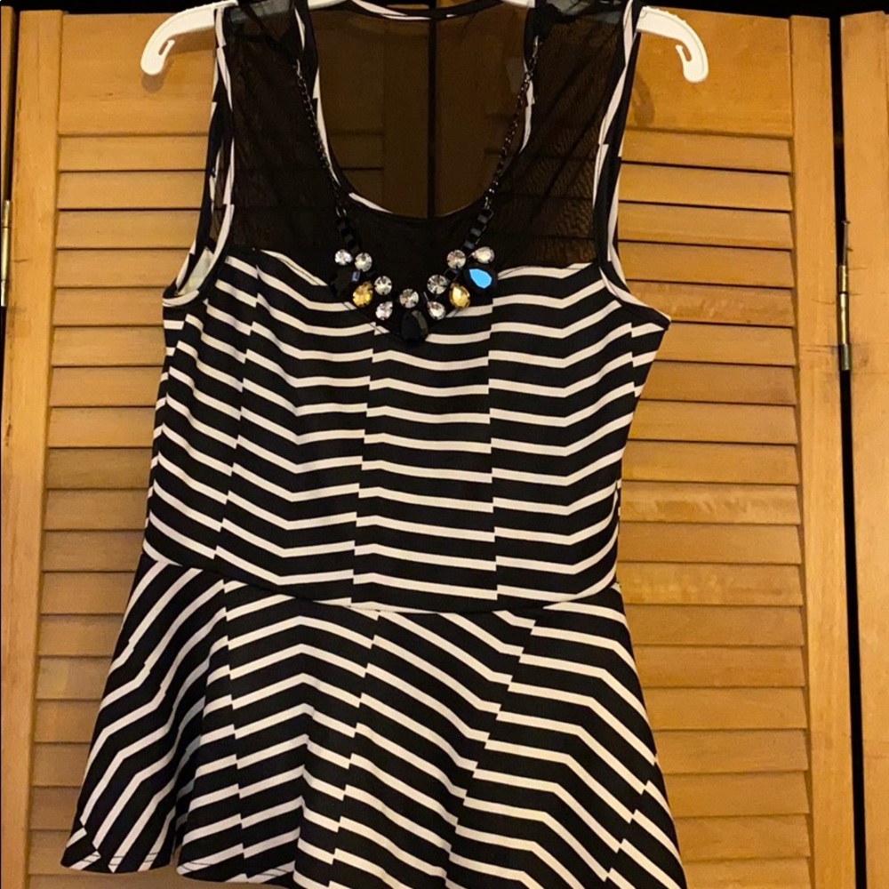 Sleeveless black and white stripe peplum top